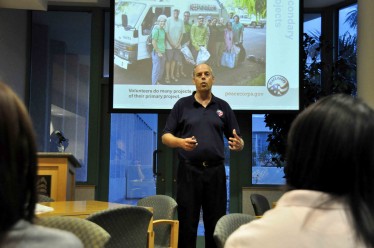 Steve Hunsicker, a South Florida regional recruiter for the Peace Corps, shares with an audience his experience of being a Peace Corps volunteer.
