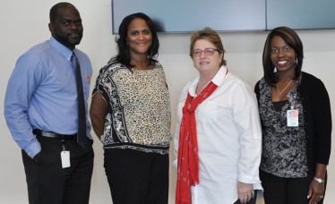 Margaret Pericak-Vance, third from left, with members of the Hussman Institute’s outreach team, from left, Larry Deon Adams, Doris Caldwell, and Krystal Murphy.