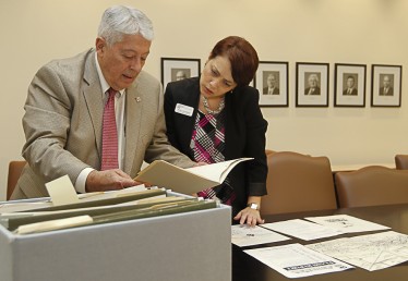 José Basulto, founder of Brothers to the Rescue, and Maria Estorino, chair of the Cuban Heritage Collection, review some of the archival materials Basulto has donated to UM Libraries' extensive repository on Cuba and the Cuban Diaspora. 