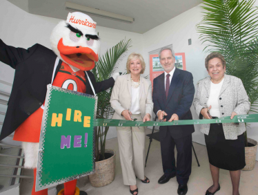Along with Sebastian the Ibis, from left, UM trustee Patricia Toppel, Board of Trustees Chairman Leonard Abess, and UM President Donna E. Shalala cut the ribbon at the Toppel Career Center's dedication.