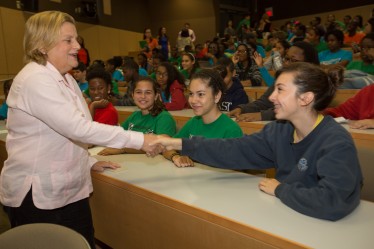At UM's Whitten Learning Center, Congresswoman Ileana Ros-Lehtinen greets one of the more than 130 students participating in Breakthrough Miami College Bound.