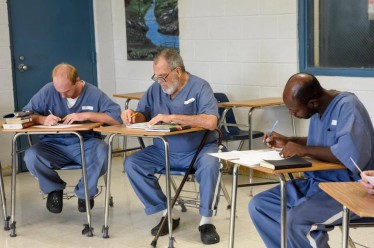 Inmates at the Dade Correctional Institution look froward to their one-on- one sessions with UM tutors. 